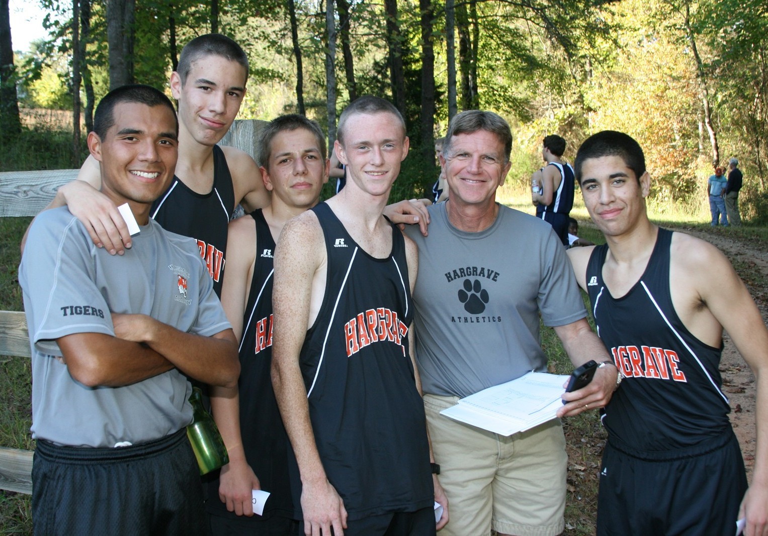 Cross Country teammembers with Coach Mike Broomell
