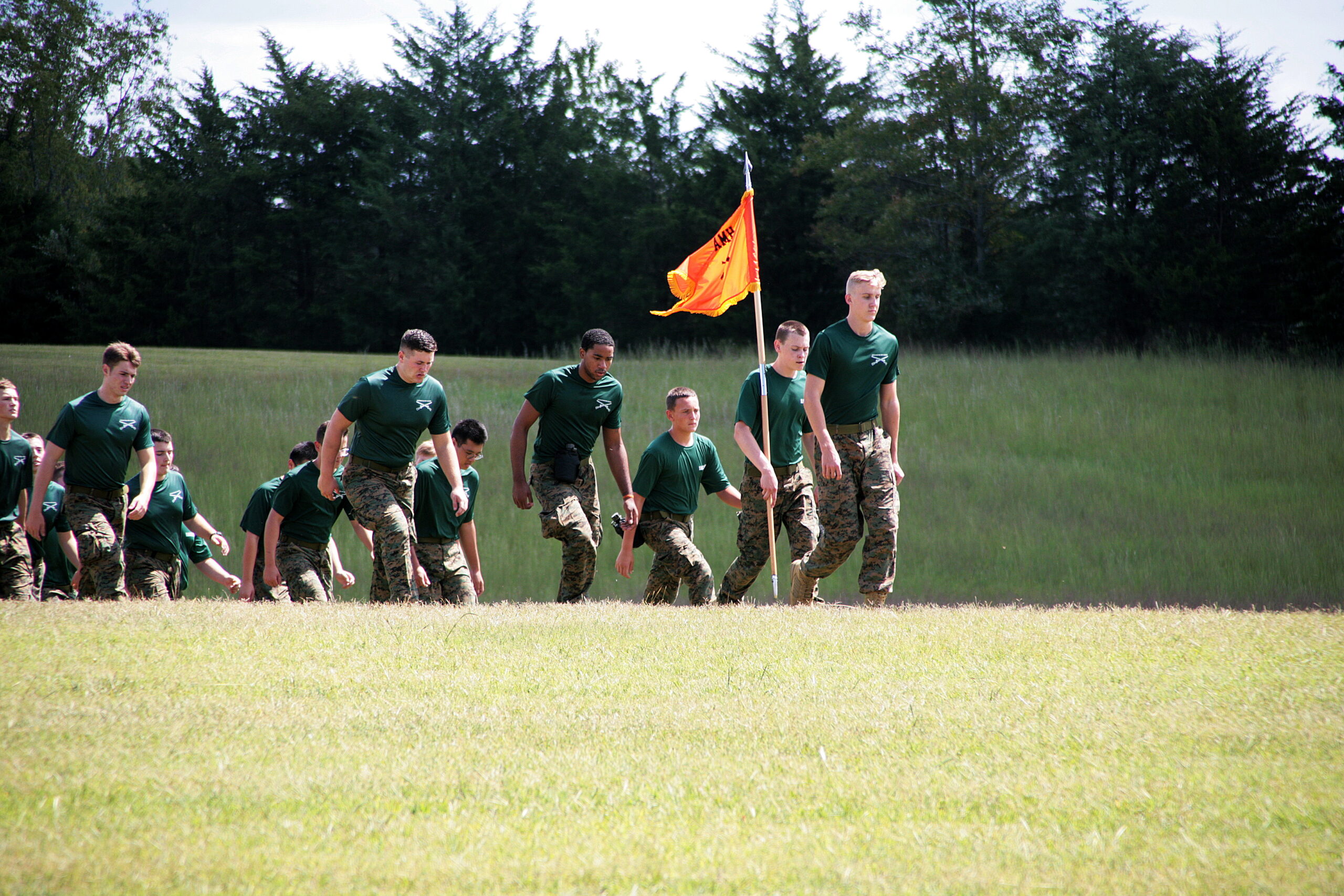 Group of cadets walking together outside.