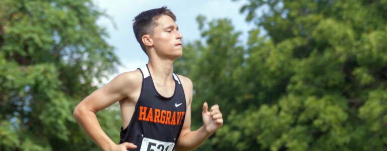 Cadet running in cross country meet.
