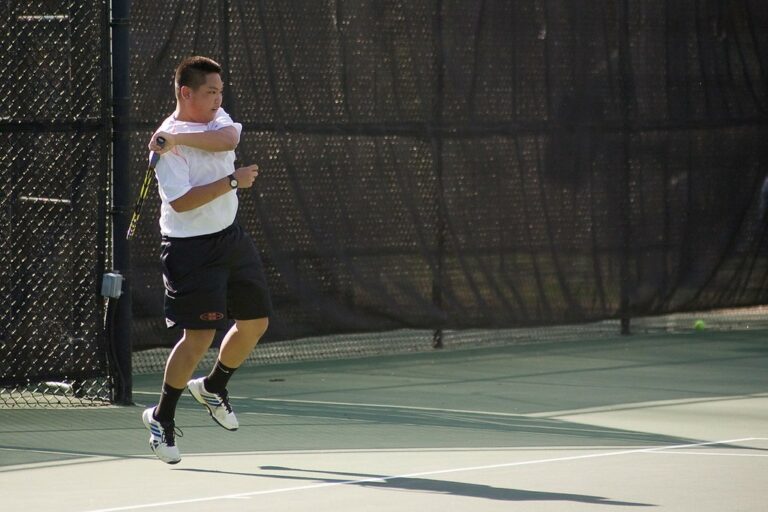 Mark Yee finishing his forehand.