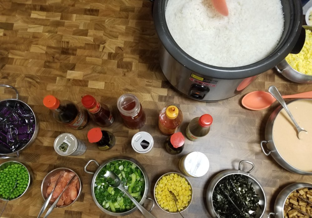 Pot of rice, vegetables, condiments, etc.