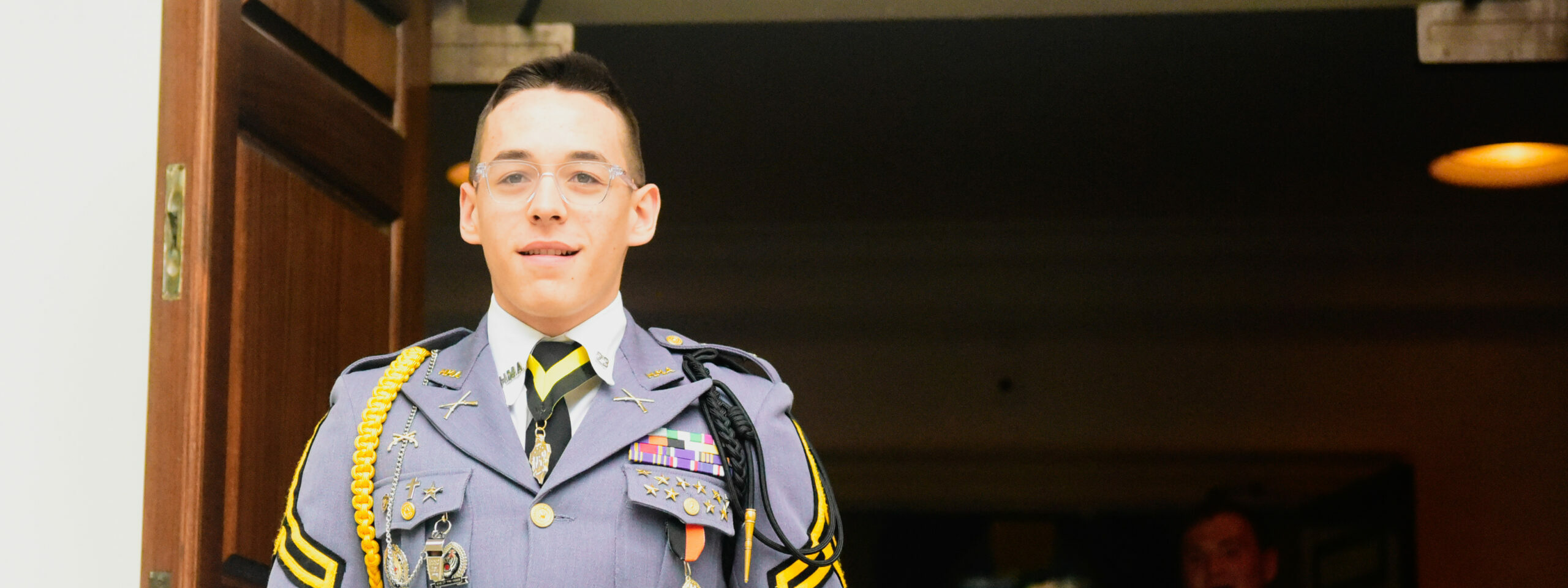 Cadet walking out of chapel.