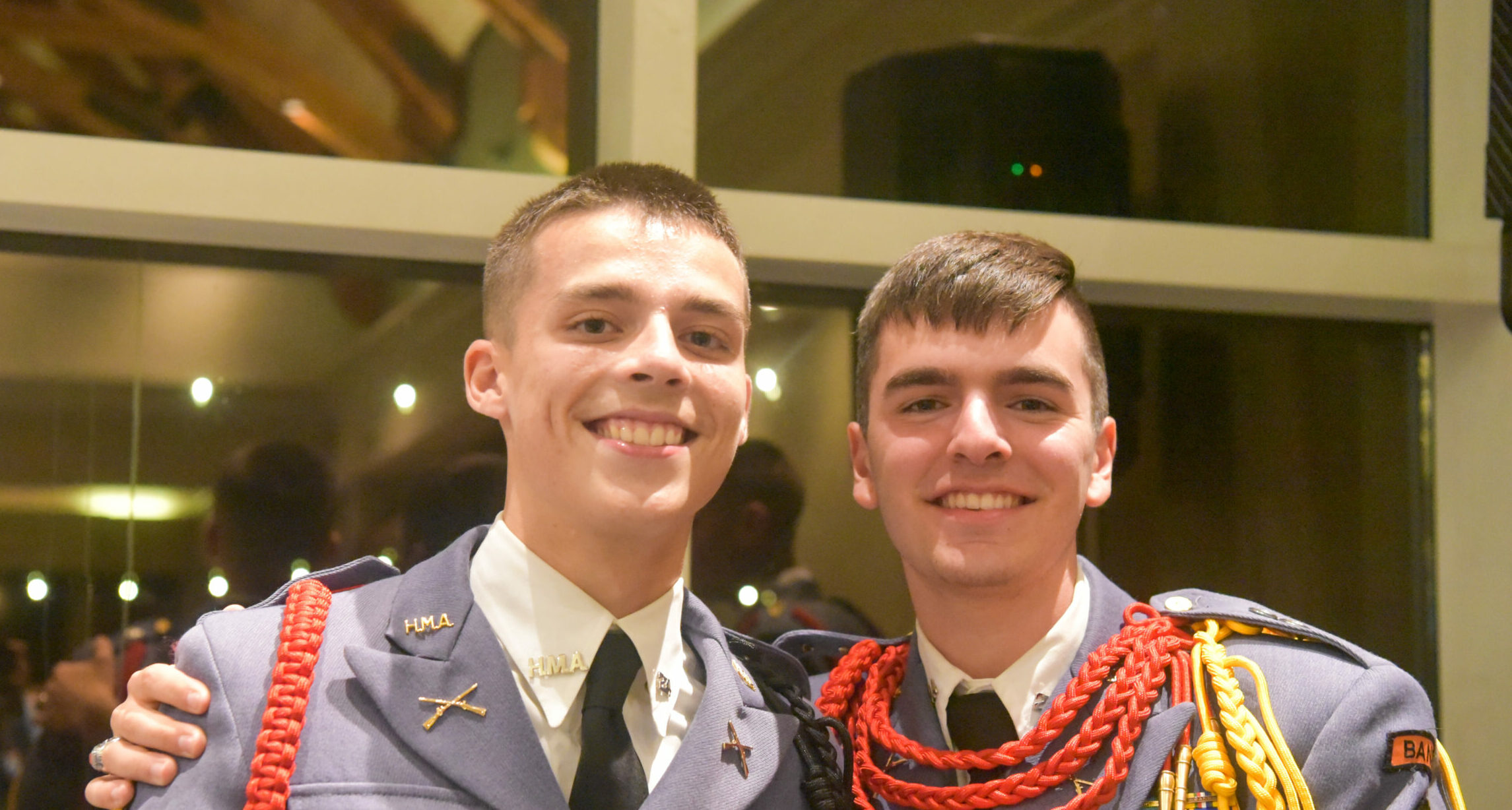 Two cadets smiling at camera during donor event.