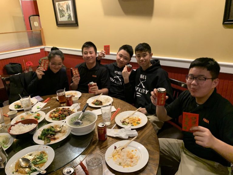 Cadets and chaperone at dinner